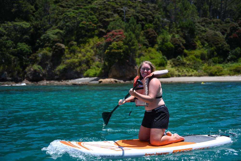 knee paddle boarding at the rock bay of islands