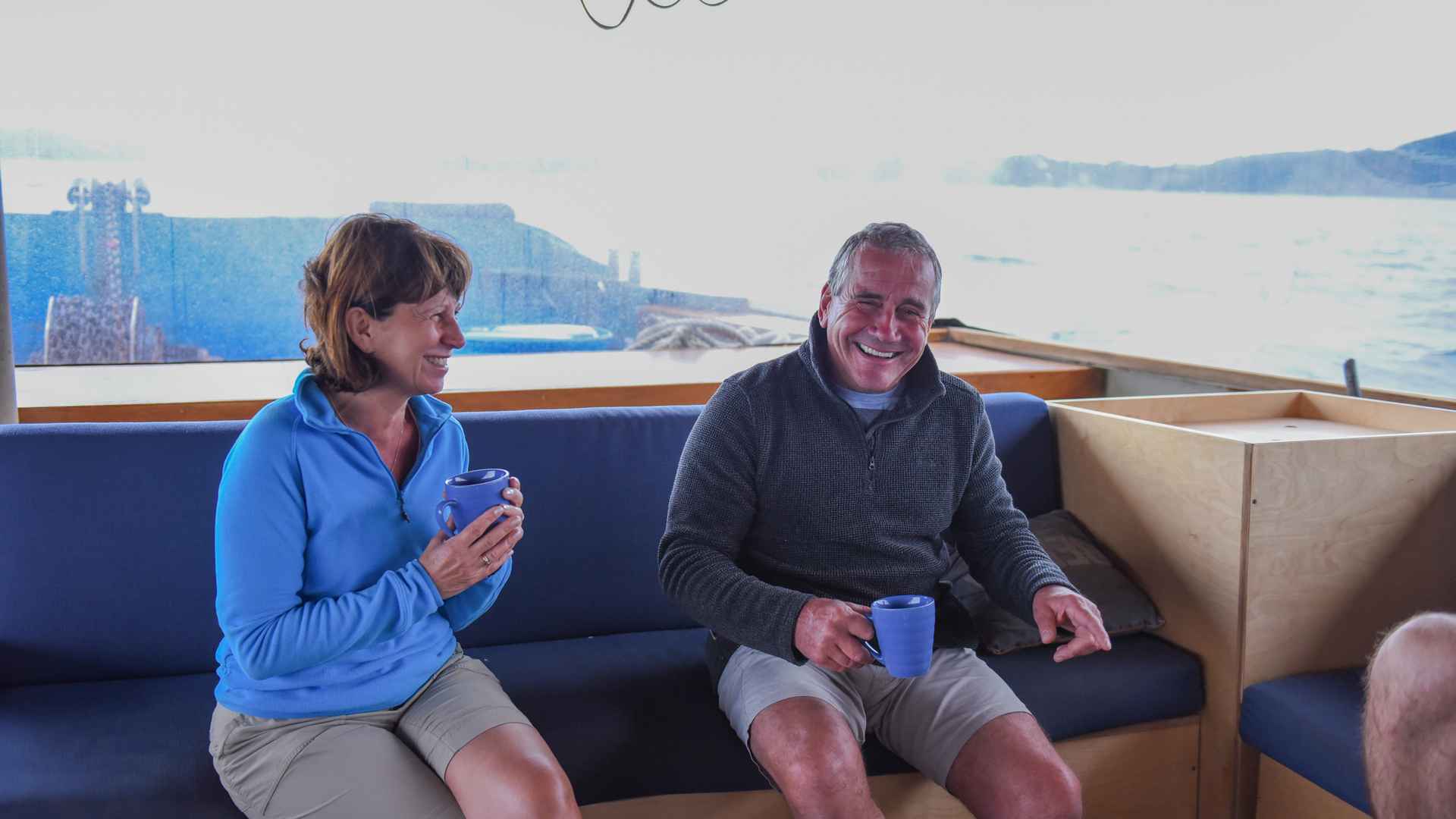 lovely couple drinking tea by the deck