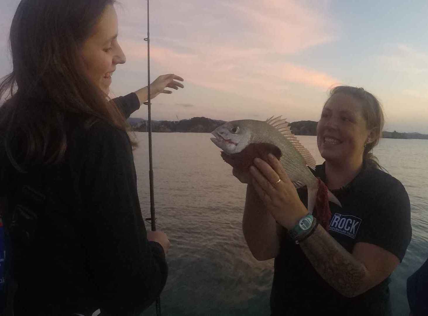 girls dusk fishing at the bay of islands