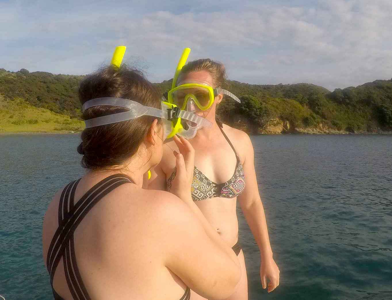 girls getting ready to snorkel at waewaetoria bay of islands