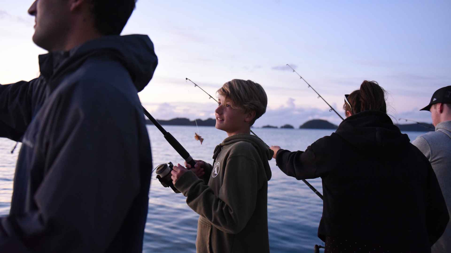 kid fishing at the rock bay of islands