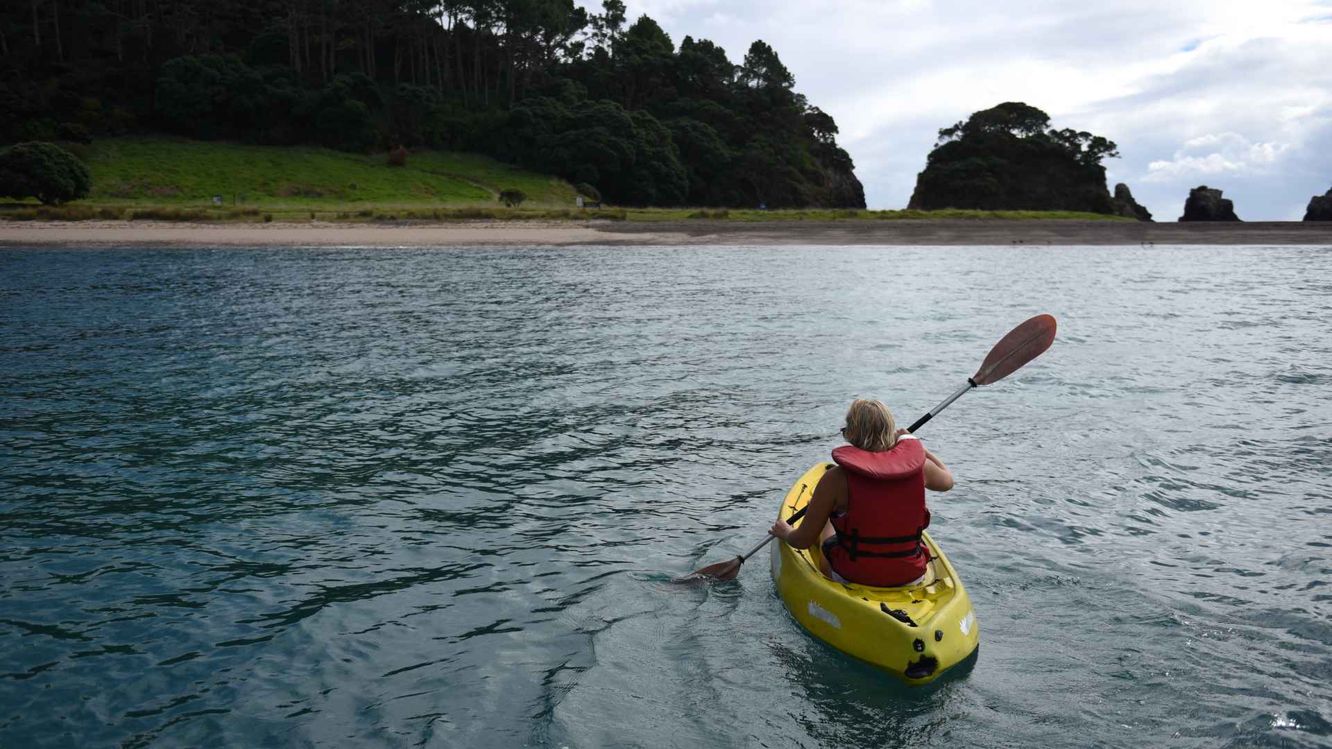 kayaking at the rock bay of islands