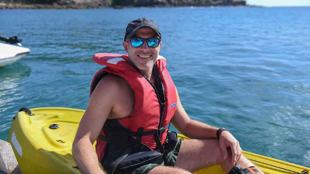 guy kayaking in the Bay of Islands